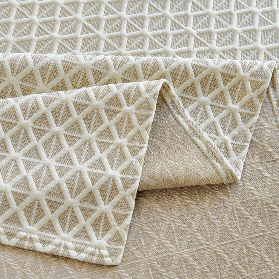 Macro of the woven Ivory Pearl fabric showing the Breeze Lattice diamond weave and border