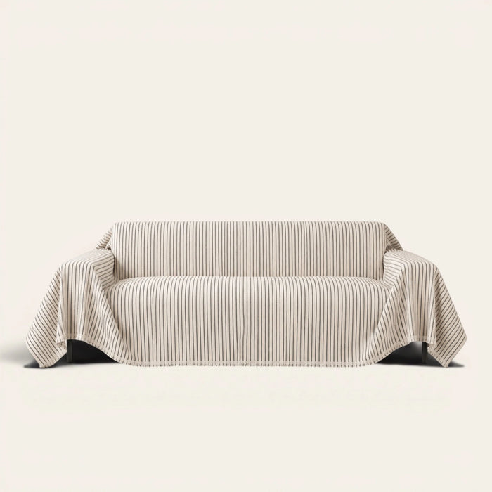 Charcoal Gray Classic Pinstripe sofa throw draped over a three seater sofa, front view on ivory background