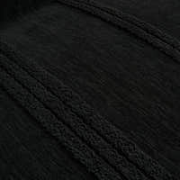 Macro close-up of the ebony elegance throw's raised black tufted stripes and soft woven texture
