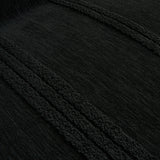 Macro close-up of the ebony elegance throw's raised black tufted stripes and soft woven texture