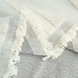 Close-up of Ivory Whisper Classic Striped throw folded to show its woven base and fringed edge