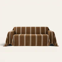 Mocha Harmony Classic Striped sofa throw draped over a two-seat sofa, front view on ivory background, tufted cream stripes