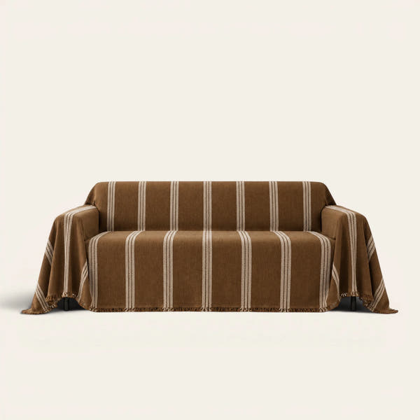 Mocha Harmony Classic Striped sofa throw draped over a two-seat sofa, front view on ivory background, tufted cream stripes