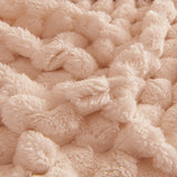 Macro of the soft plush bubble texture of the Cozy Chic throw in Blush Pink
