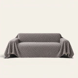 Slate Gray Cozy Chic sofa throw draped over a full couch, front view on ivory background