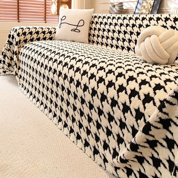 Ivory Black Cozy Houndstooth throw styled on a sofa with cushions in a cozy living room