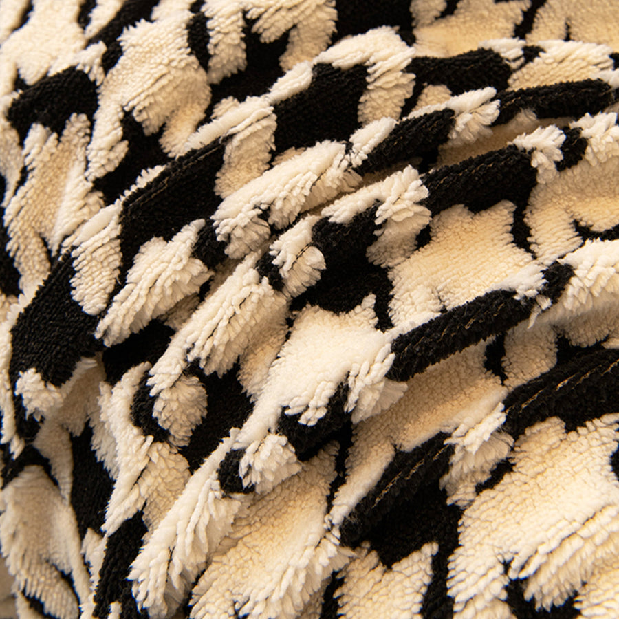 Macro of the plush Ivory Black fabric showing the Cozy Houndstooth woven pattern