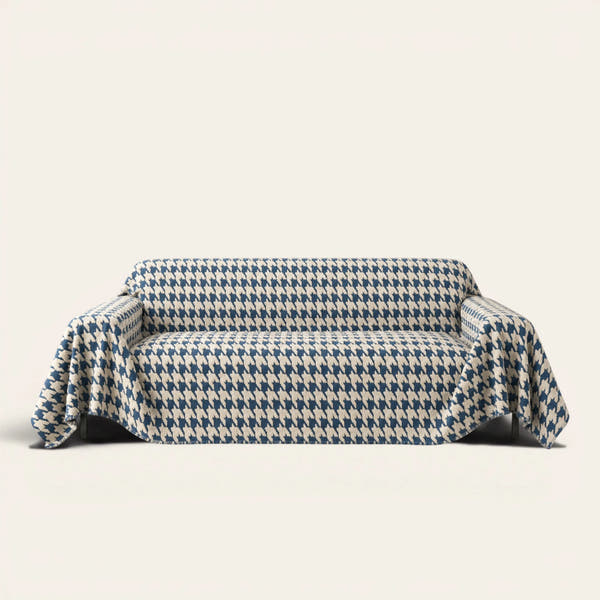 Cozy Houndstooth Ocean Blue sofa throw draped over a three-seat sofa, front view on ivory