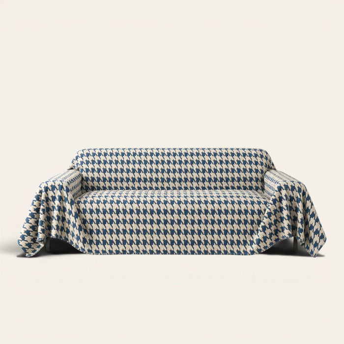 Cozy Houndstooth Ocean Blue sofa throw draped over a three-seat sofa, front view on ivory