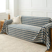 Cozy Houndstooth Ocean Blue throw covering a sofa, wide angled living room view
