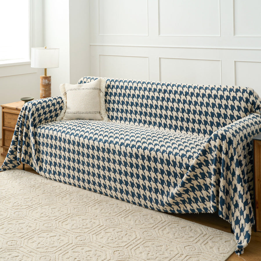 Cozy Houndstooth Ocean Blue throw covering a sofa, wide angled living room view