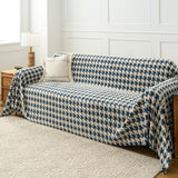 Cozy Houndstooth Ocean Blue throw covering a sofa, wide angled living room view