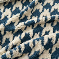 Macro of the plush Ocean Blue Cozy Houndstooth weave in blue and cream