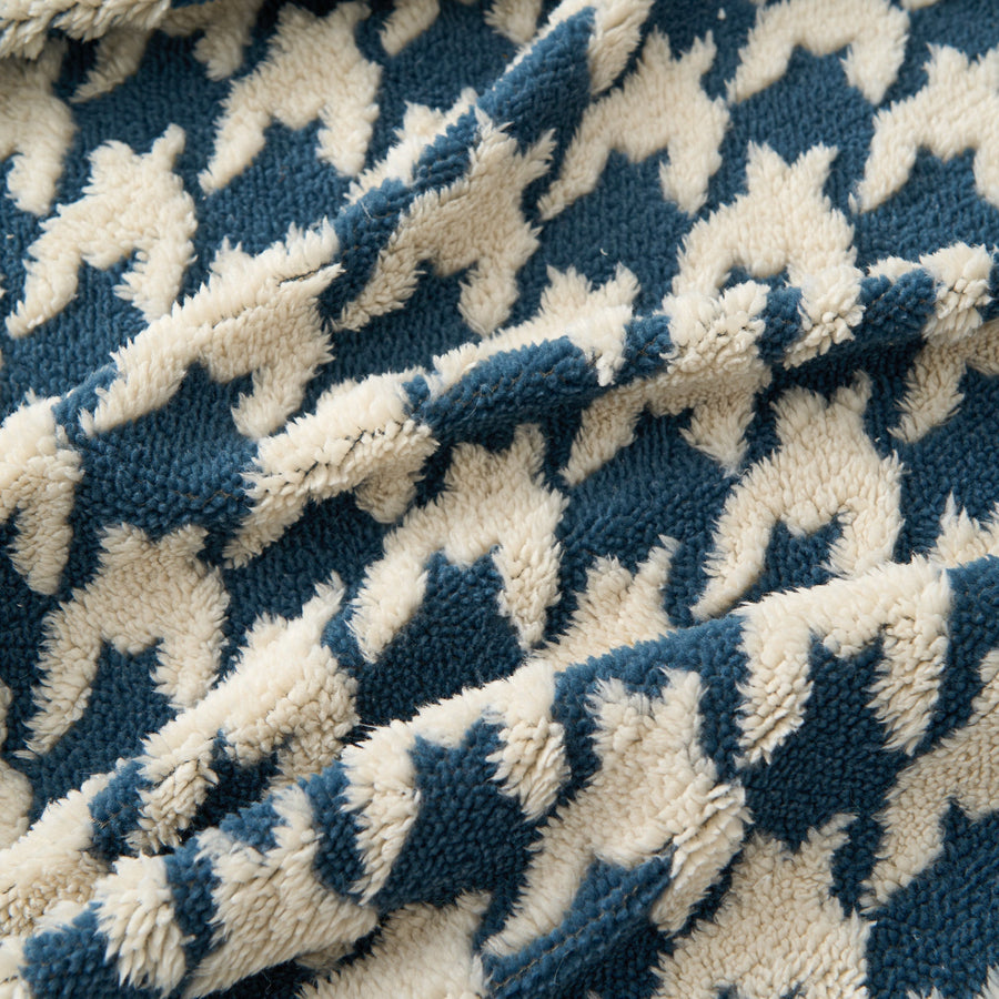 Macro of the plush Ocean Blue Cozy Houndstooth weave in blue and cream