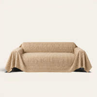 French Vintage Oat Beige sofa throw draped over a three-seat sofa, front view on ivory
