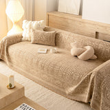Oat Beige French Vintage throw covering a sofa with boucle knot cushion, wide warm view
