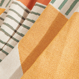 Macro close-up of Citrus Burst Fruitopia throw showing the woven green, yellow and coral pattern