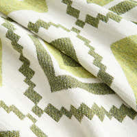Macro of the woven Green Geometry fabric showing the Geometric Boho zigzag pattern