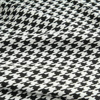 Macro of Midnight Hound Houndstitch fabric, a tight black and white houndstooth weave