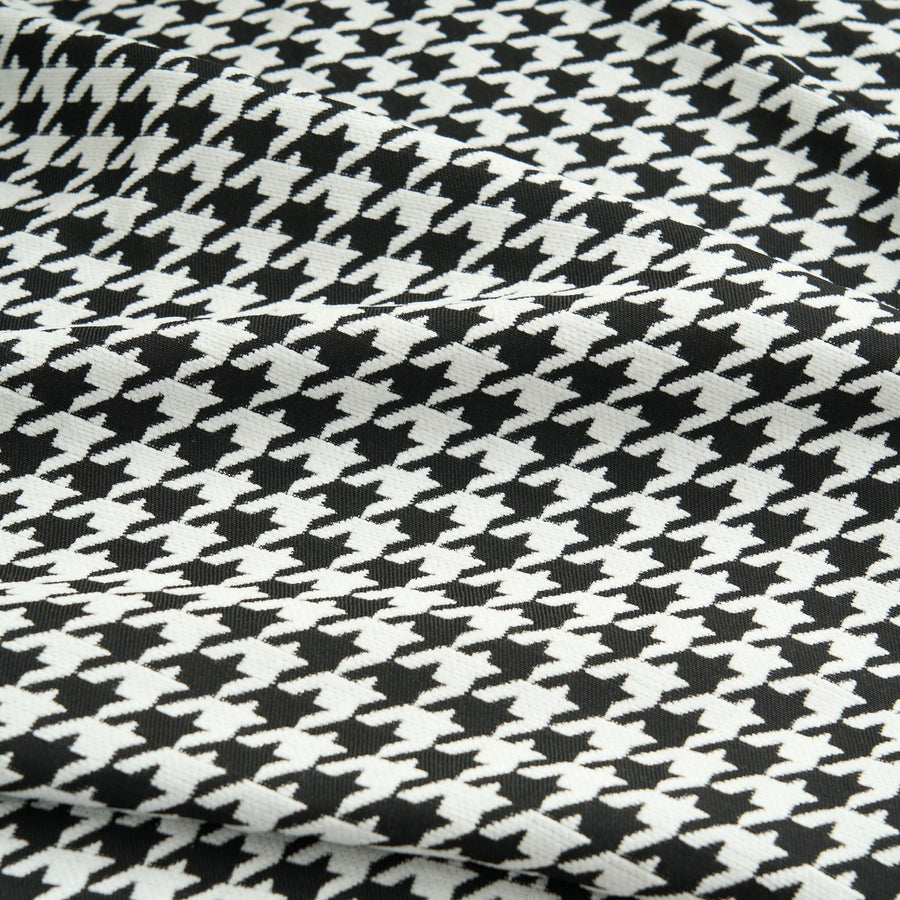 Macro of Midnight Hound Houndstitch fabric, a tight black and white houndstooth weave