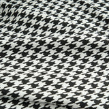 Macro of Midnight Hound Houndstitch fabric, a tight black and white houndstooth weave