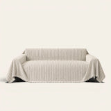 Charcoal Stripe Linear Weave sofa throw draped over a three seater sofa, front view on ivory background