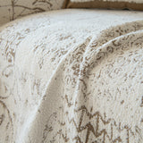 Macro close-up of the cream latte Luxe Heritage woven fabric and its soft chenille texture