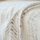 Macro of the pearl beige chenille weave showing subtle chevron texture
