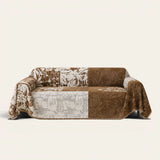 Mocha Pearl Luxe Patchwork sofa throw draped over a two-seat sofa, front view on ivory background, mixed floral patchwork blocks