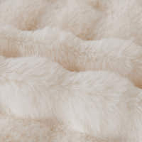 Close-up of the rippled Ivory Luxe faux fur showing the Luxe Ripple plush texture