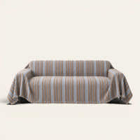 Slate Blue Metro Stripe sofa throw draped over a full couch, front view on ivory background