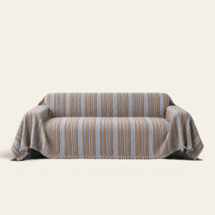 Slate Blue Metro Stripe sofa throw draped over a full couch, front view on ivory background
