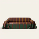 Brick Olive Modern Striped sofa throw draped over a three seater sofa, front view on ivory background