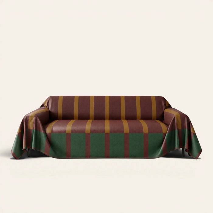 Brick Olive Modern Striped sofa throw draped over a three seater sofa, front view on ivory background