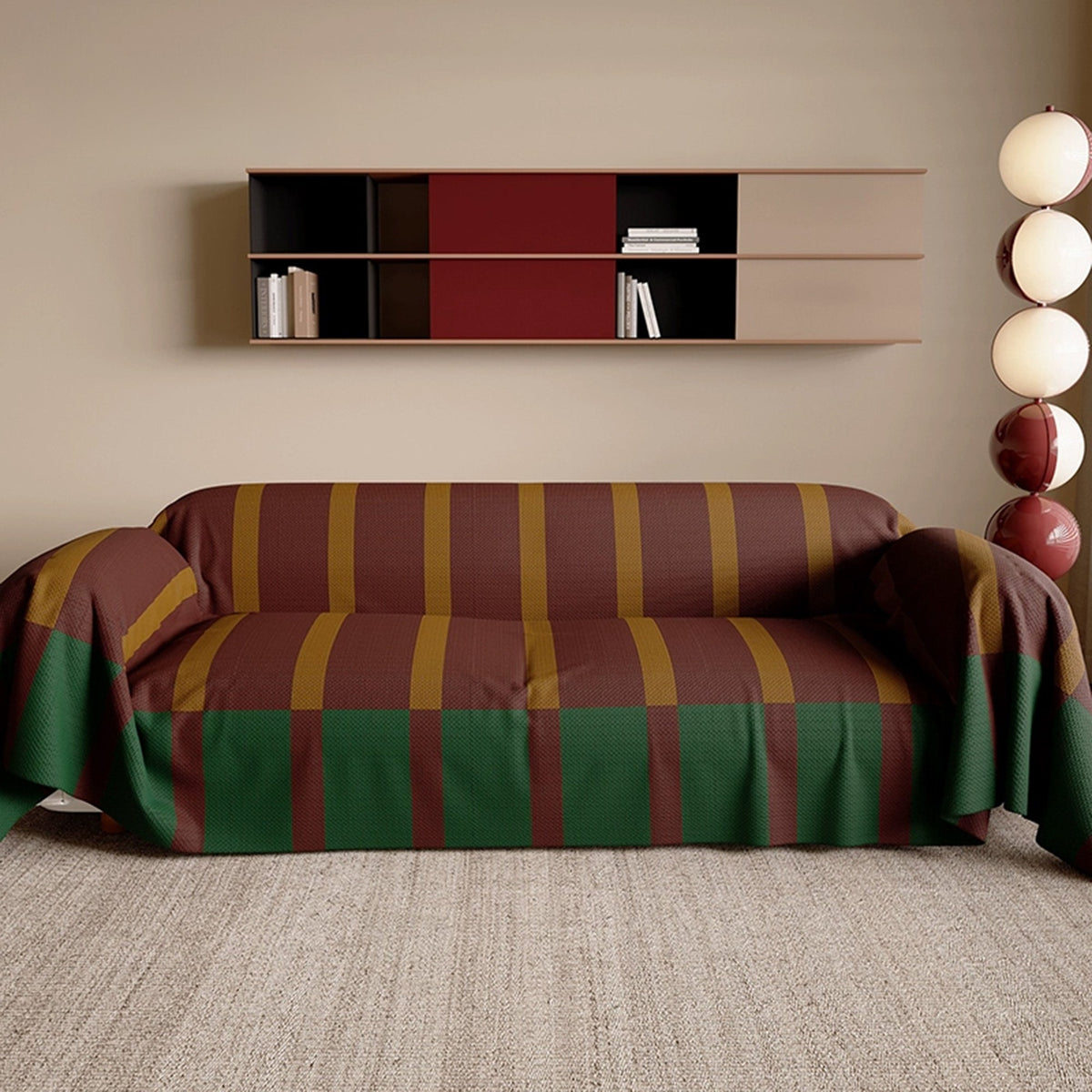 Brick Olive Modern Striped throw covering a sofa in a warm living room with wall shelf and sculptural lamp