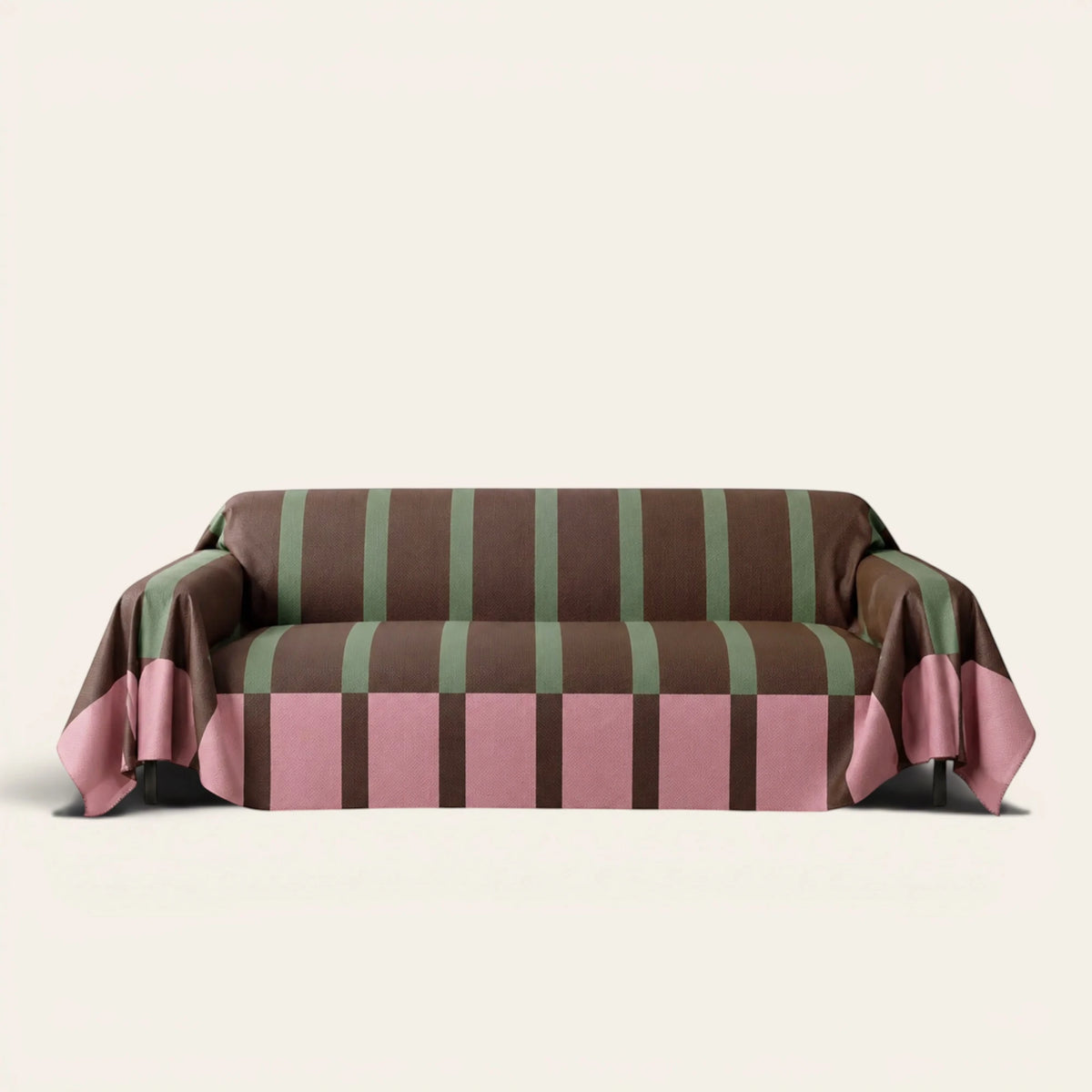 Modern Striped Mocha Rose sofa throw draped over a three-seat sofa, front view on ivory