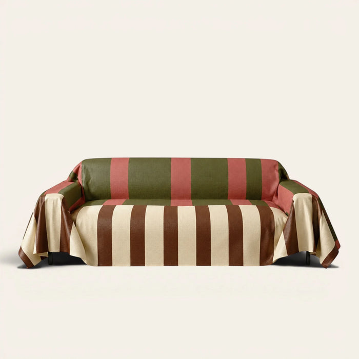 Modern Striped Olive Rust sofa throw draped over a three-seat sofa, front view on ivory