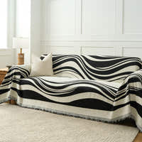 Monochrome Wave Modern Wave throw covering a sofa, wide angled living room view