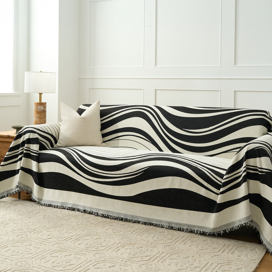 Monochrome Wave Modern Wave throw covering a sofa, wide angled living room view