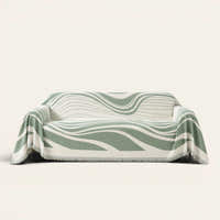 Verdant Flow Modern Wave sofa throw draped over a full couch, front view on ivory background