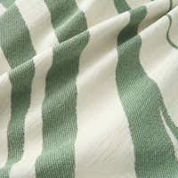 Macro of the Verdant Flow Modern Wave fabric showing sage green and cream woven stripes