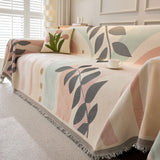 Garden arch Natural Botanical throw over a sofa with a tulip cushion and coffee cup, tasseled hem