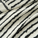 Macro of the Monochrome Stripe woven fabric showing crisp black and cream Sightline Stripes