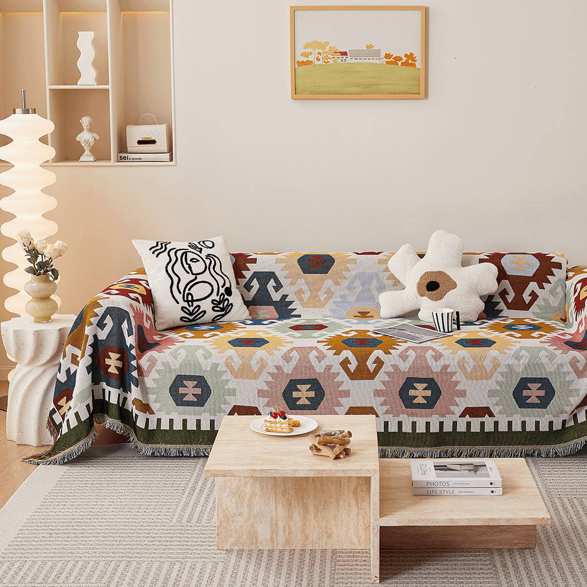 Ivory Blooms Sunflowers Fantasy throw styled on a sofa with cushions and wall art in a colorful room