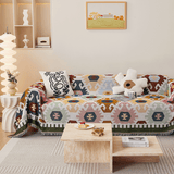Ivory Blooms Sunflowers Fantasy throw styled on a sofa with cushions and wall art in a colorful room