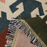 Close-up of the fringed tasseled edge of the Ivory Blooms Sunflowers Fantasy throw