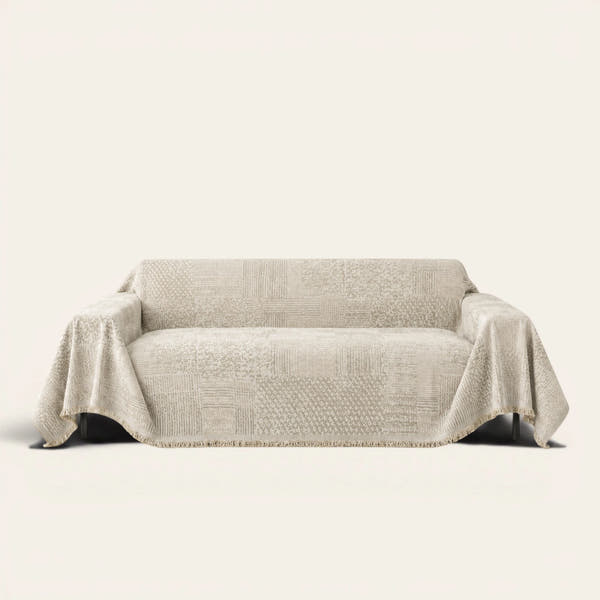 Sand Beige Textured Mosaic throw draped over a two-seat sofa on ivory background
