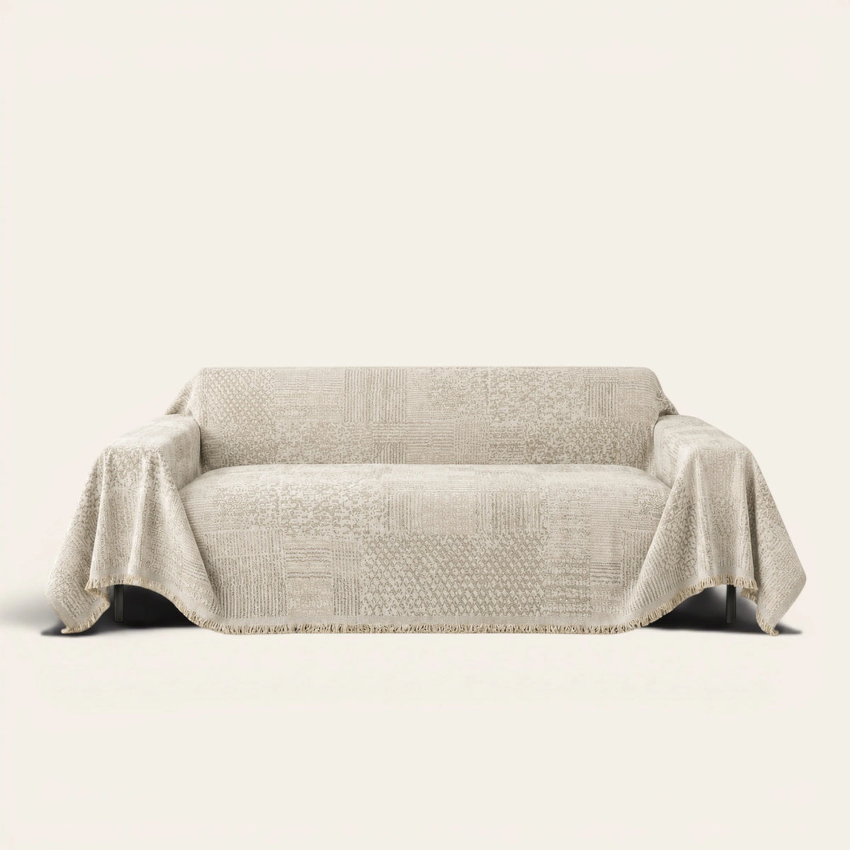 Sand Beige Textured Mosaic throw draped over a two-seat sofa on ivory background