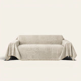 Sand Beige Textured Mosaic throw draped over a two-seat sofa on ivory background
