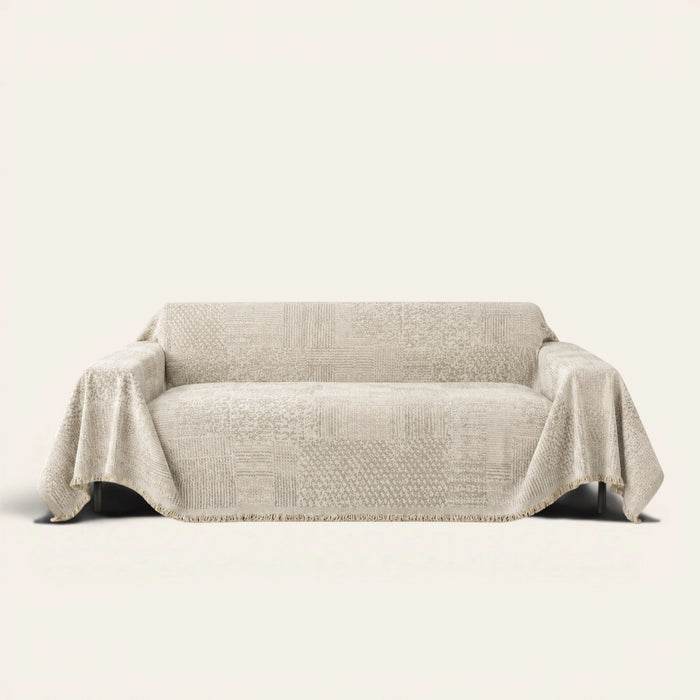 Sand Beige Textured Mosaic throw draped over a two-seat sofa on ivory background